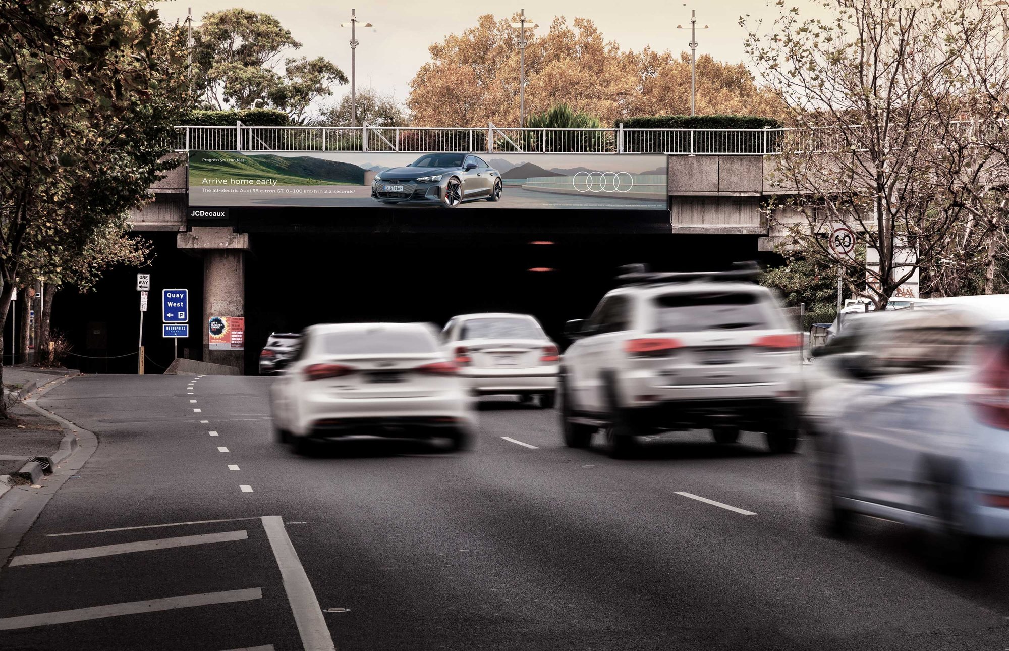 Audi billboard promoting the Audi E-tron hybrid car on roadside bridge of Victoria, Australia