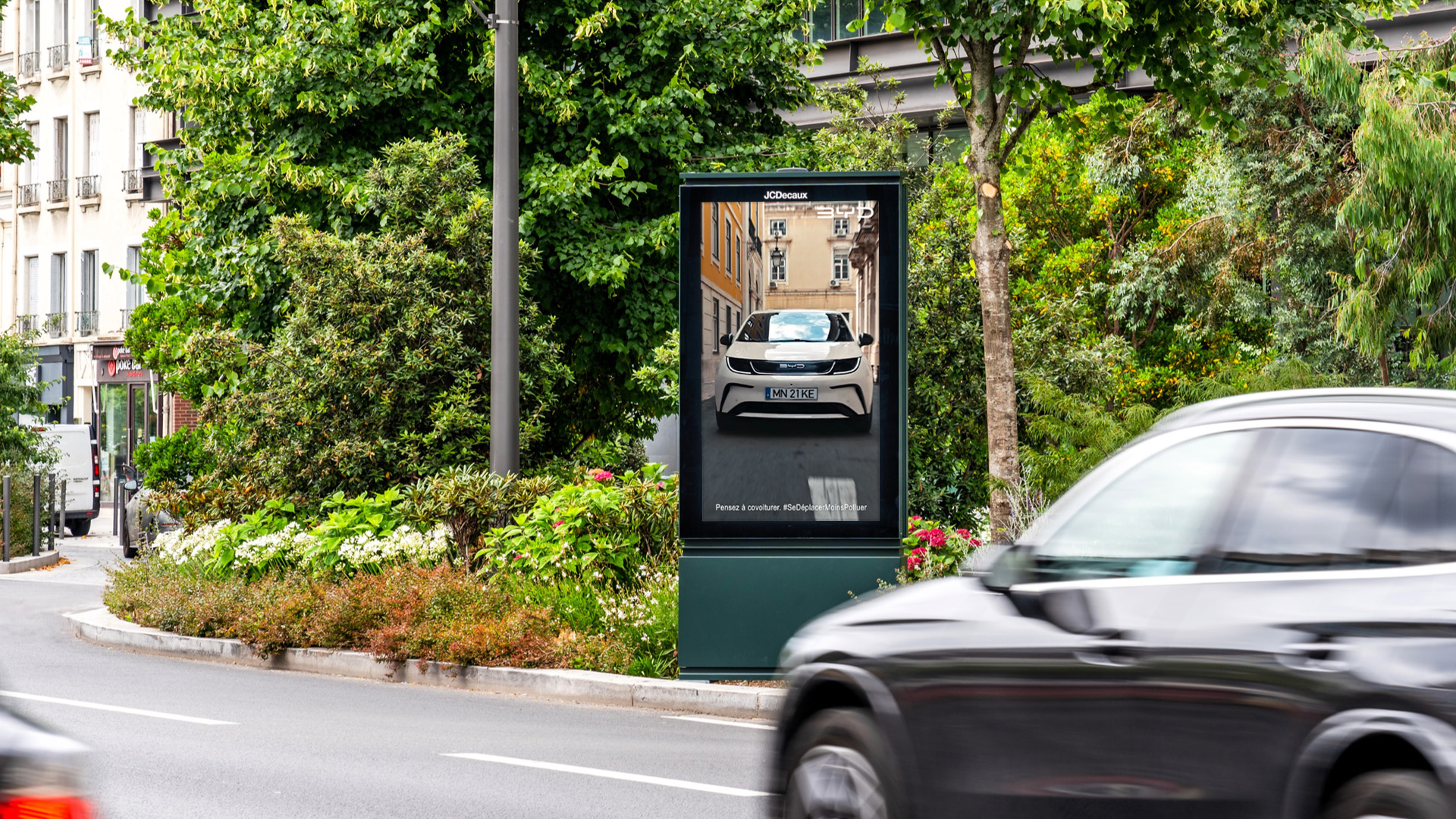 BYD advertising their new electric vehicle range on a digital street furniture screen