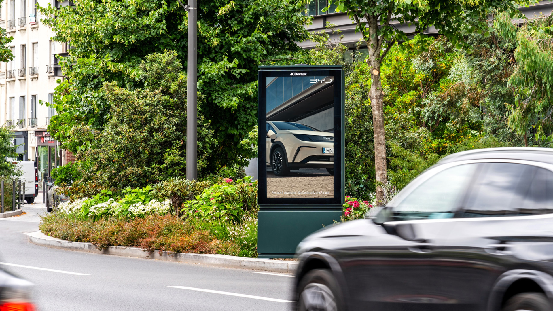 BYD advertising their new electric vehicle range on a digital street furniture screen