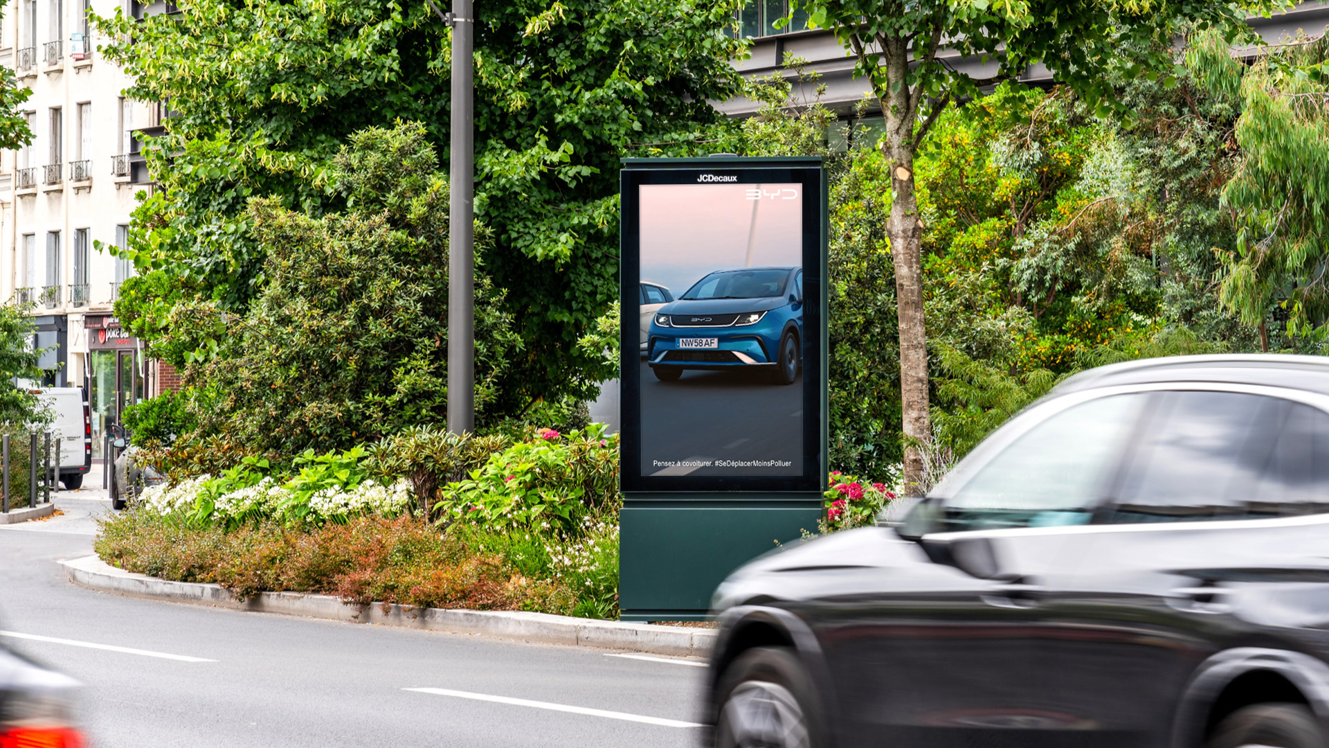 BYD advertising their new electric vehicle range on a digital street furniture screen