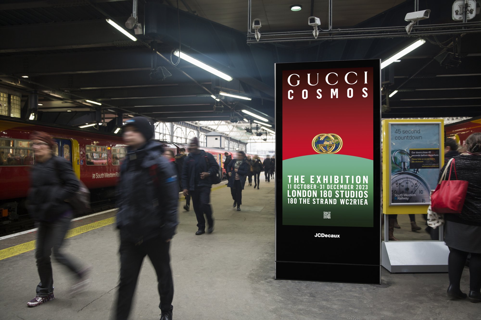 Digital screen in a rail station advertising Gucci Cosmos exhibition