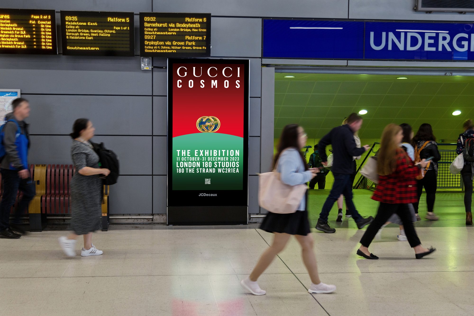 Digital screen in a rail station advertising Gucci Cosmos exhibition